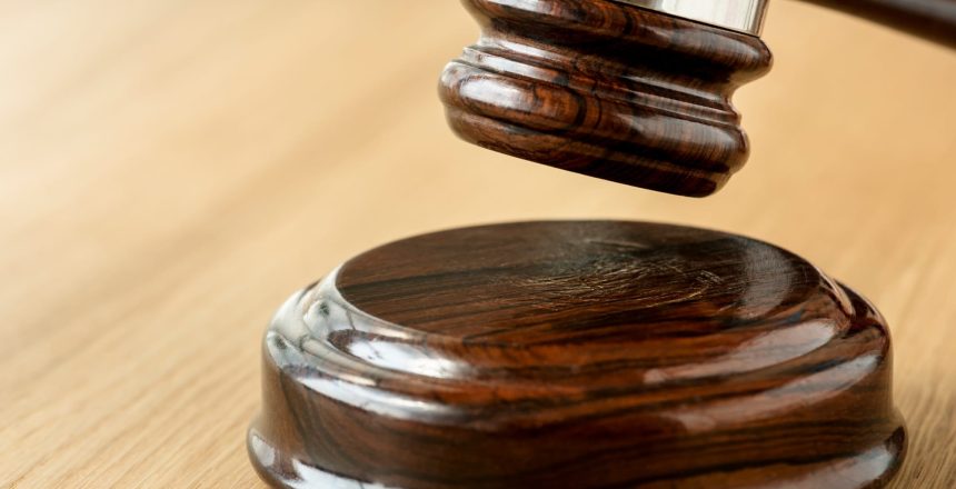 Closeup of a judge's gavel. For our blog about Effectively Recovering Court-Ordered Debts in Virginia